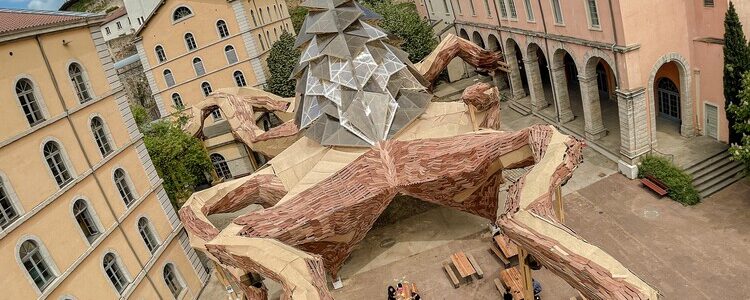Installation of a Kraken Crafted from Reclaimed Wood Extends its Tentacles in Lyon.